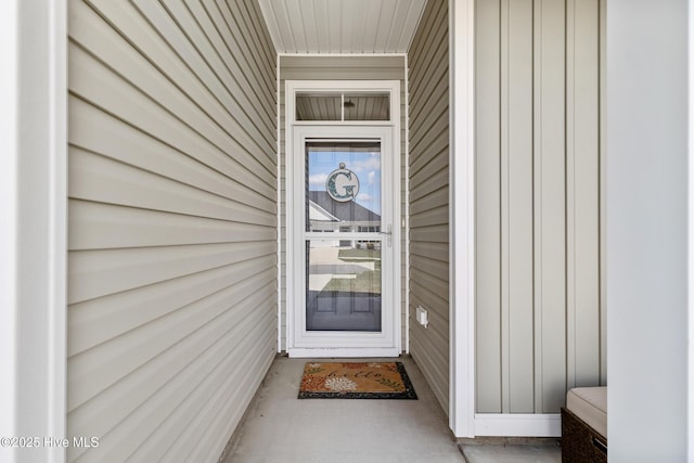 doorway to property with board and batten siding