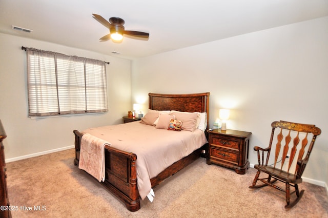 bedroom with baseboards, visible vents, carpet flooring, and a ceiling fan