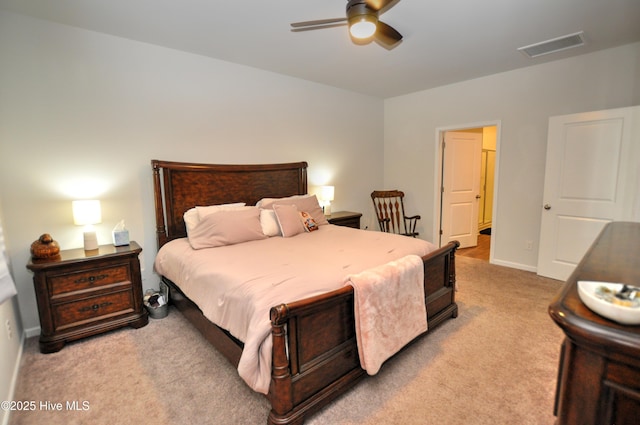 bedroom with baseboards, ceiling fan, visible vents, and light colored carpet