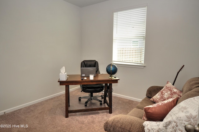 carpeted office featuring baseboards