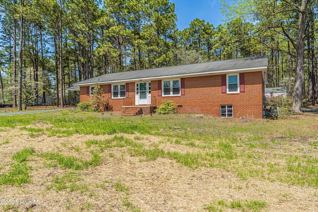 ranch-style house featuring brick siding