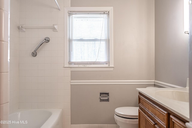 full bathroom featuring toilet, vanity, and shower / bathtub combination