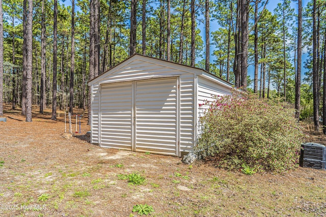 garage featuring a shed