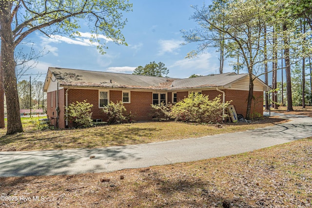 view of front of house with brick siding