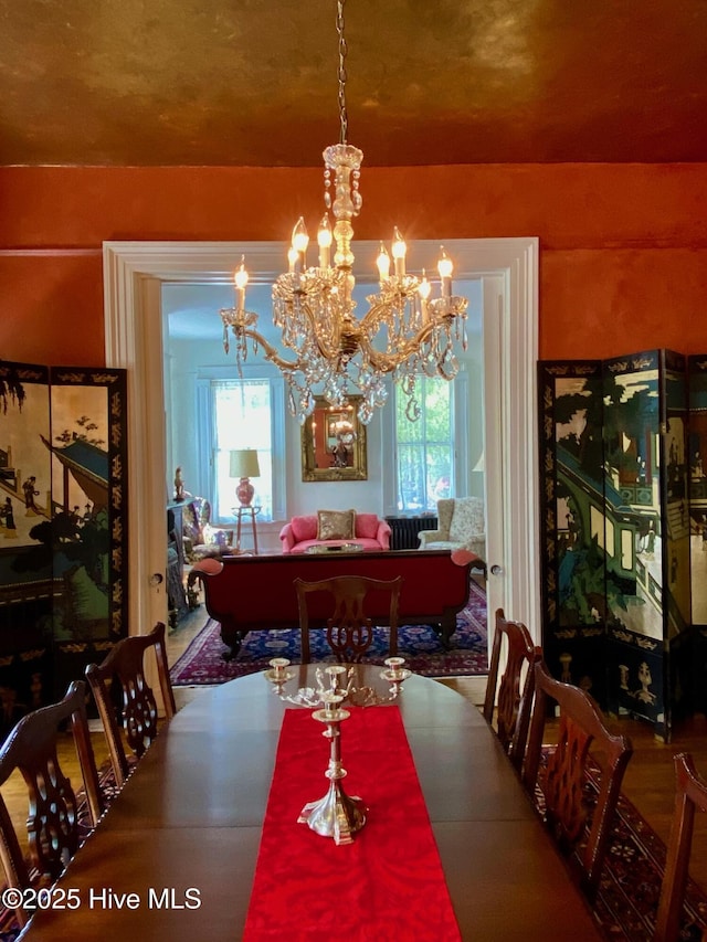 dining area with a healthy amount of sunlight and an inviting chandelier