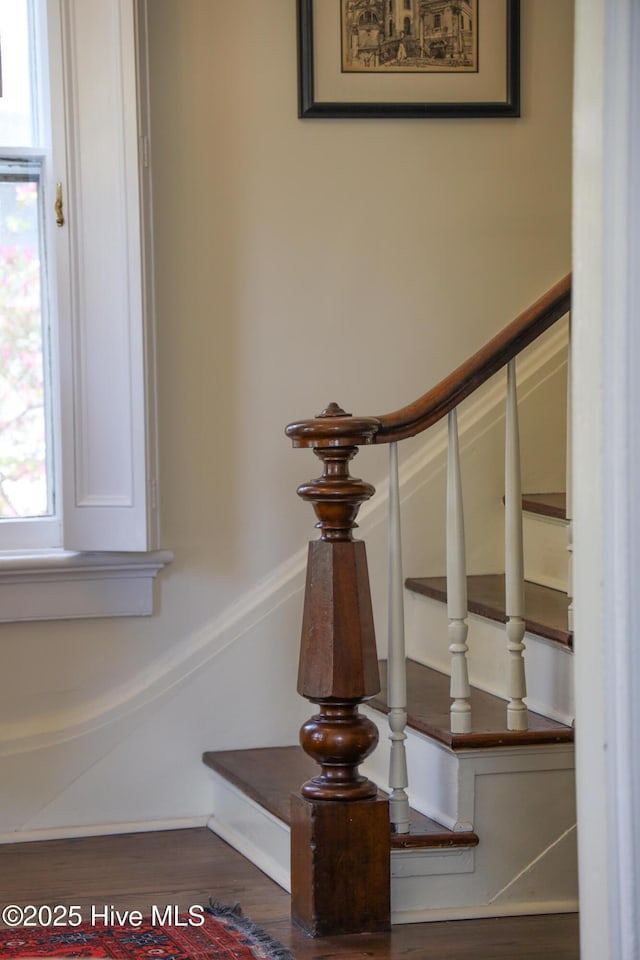 interior details with wood finished floors and baseboards