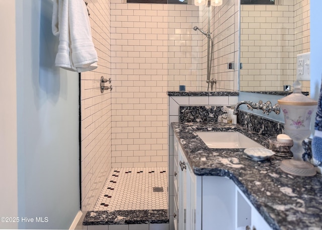 full bath with vanity and a stall shower