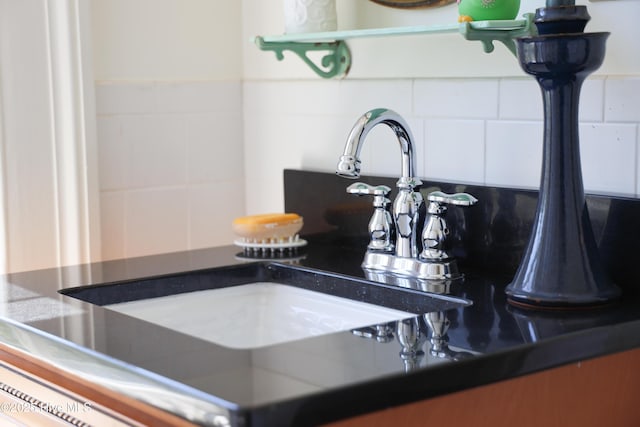details featuring backsplash and a sink
