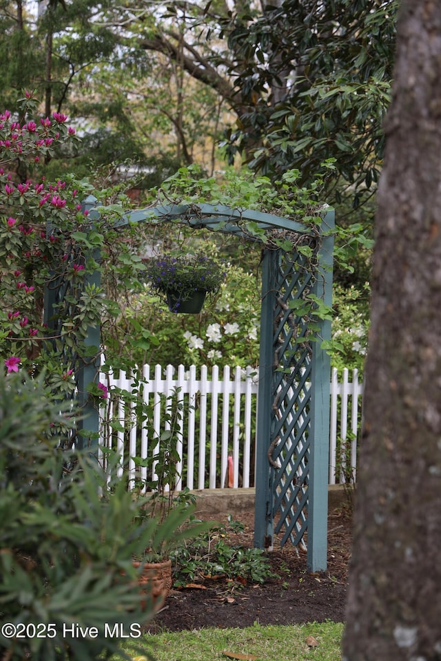 view of gate with fence