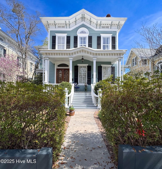 italianate house with a porch and stairway