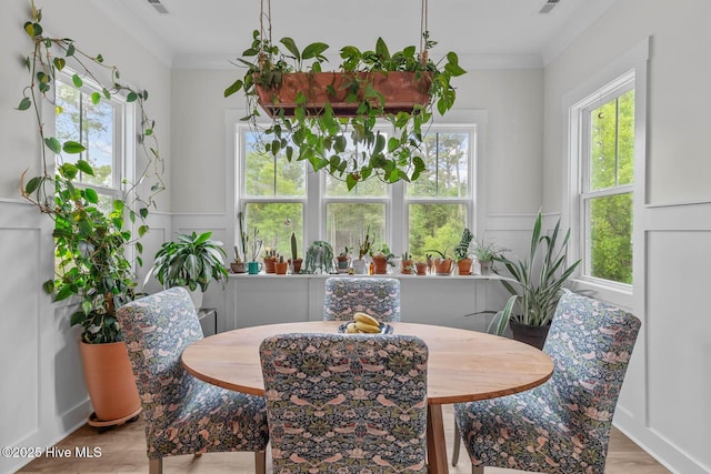 dining room featuring crown molding and wood finished floors