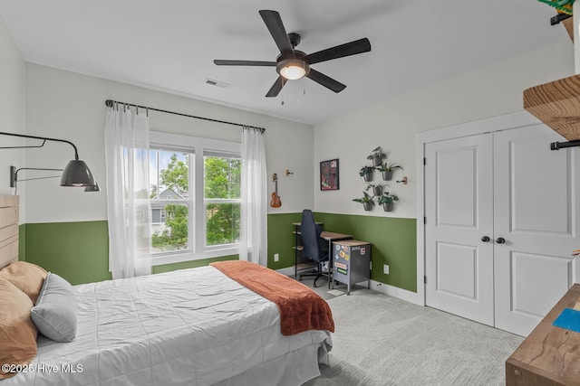 bedroom with carpet, a ceiling fan, baseboards, visible vents, and a closet