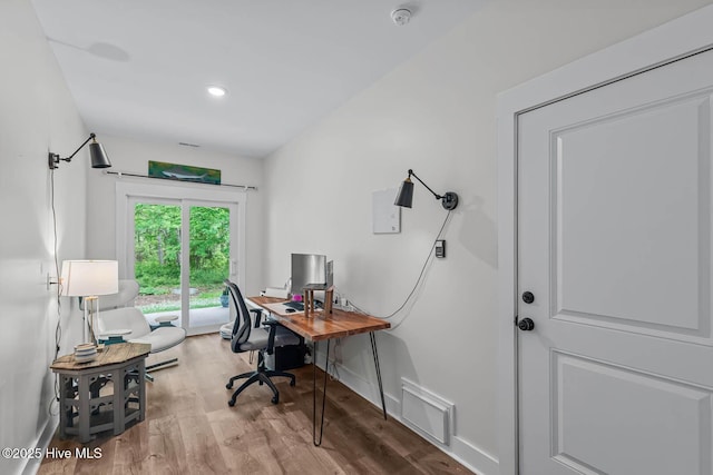 office featuring visible vents, recessed lighting, baseboards, and wood finished floors