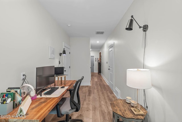 office area with visible vents and light wood-type flooring