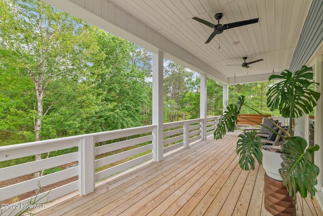 deck featuring a ceiling fan and covered porch