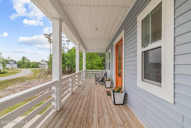 wooden deck featuring covered porch