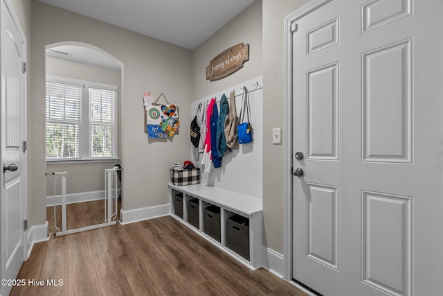 104 Plantation Dr, Southern Pines, NC 28387 - mudroom with arched walkways, dark wood-type flooring, and baseboards