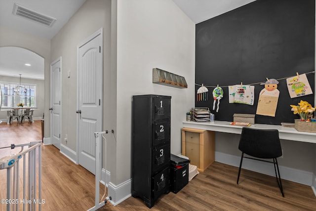 104 Plantation Dr, Southern Pines, NC 28387 - home office with built in desk, wood finished floors, baseboards, and visible vents