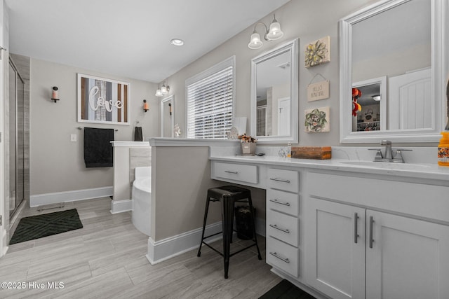 104 Plantation Dr, Southern Pines, NC 28387 - full bathroom with a tub to relax in, baseboards, vanity, and a shower with door
