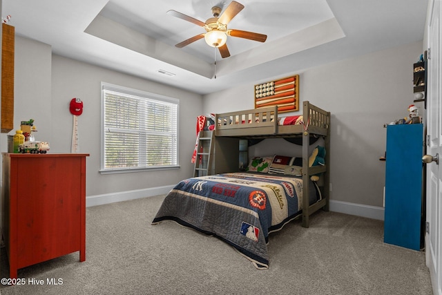 104 Plantation Dr, Southern Pines, NC 28387 - bedroom with a tray ceiling, baseboards, visible vents, and carpet floors