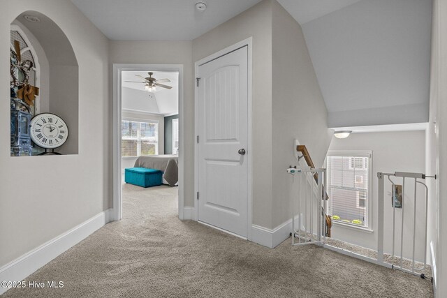 104 Plantation Dr, Southern Pines, NC 28387 - hallway featuring arched walkways, carpet, and baseboards