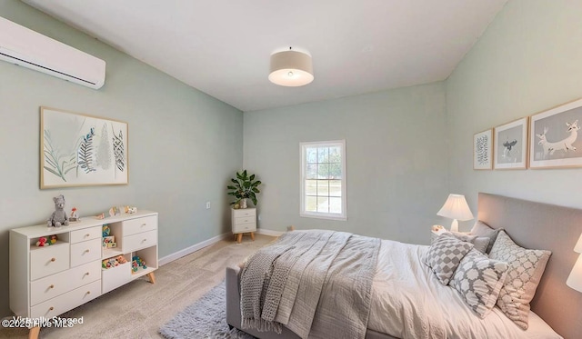 bedroom with light carpet, baseboards, and a wall unit AC