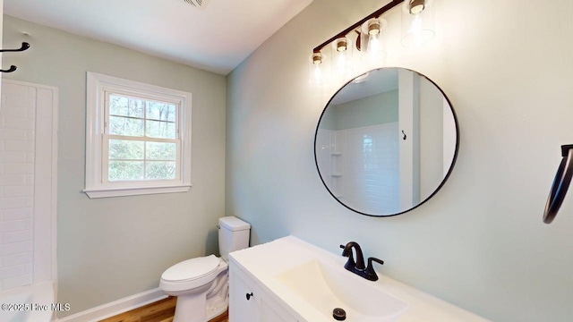 full bath with toilet, baseboards, wood finished floors, and vanity