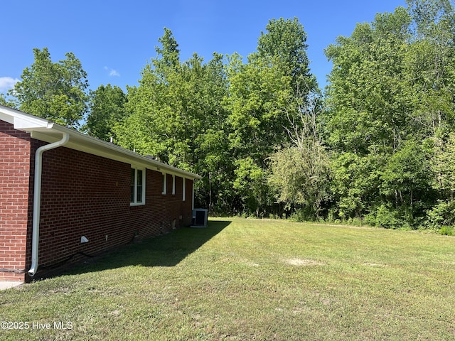 view of yard featuring central AC