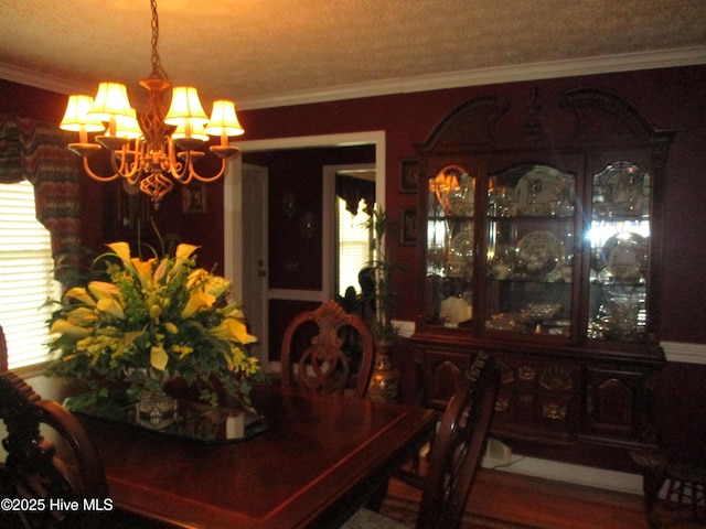 3550 Grainger Station Rd, Grifton, NC 28530 - dining area with a chandelier, ornamental molding, a textured ceiling, and wood finished floors