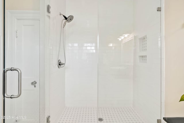 bathroom with a shower stall