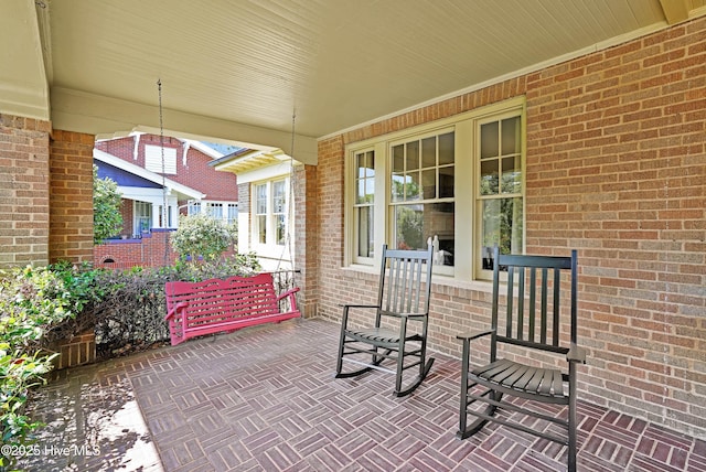 dining room with ornamental molding, dark wood finished floors, and plenty of natural light