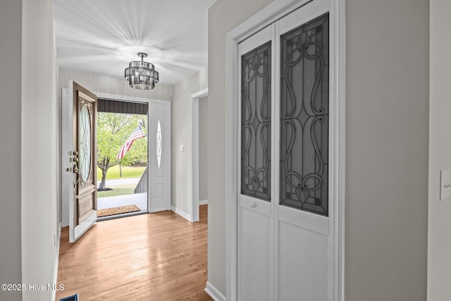 301 Pine Crest Rd, Trent Woods, NC 28562 - entrance foyer featuring a chandelier, light wood finished floors, and baseboards