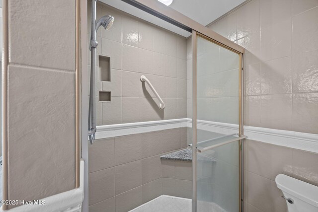 301 Pine Crest Rd, Trent Woods, NC 28562 - full bathroom with tile walls, toilet, and a stall shower