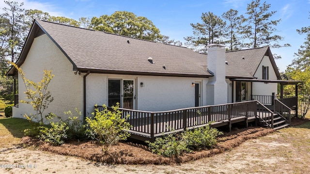 301 Pine Crest Rd, Trent Woods, NC 28562 - rear view of house with a wooden deck, a shingled roof, brick siding, and a chimney