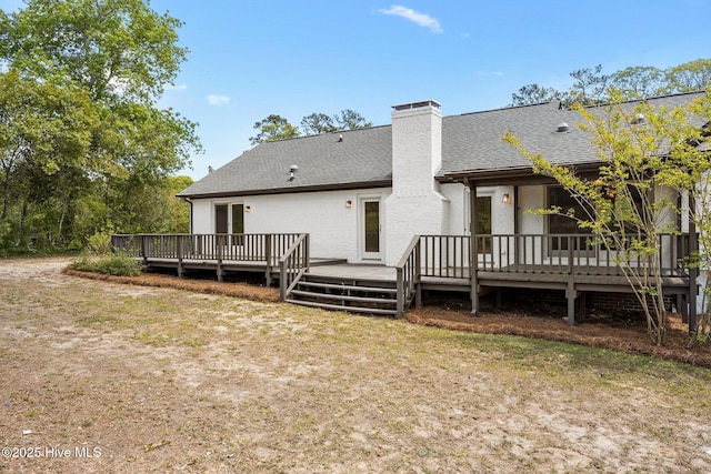 301 Pine Crest Rd, Trent Woods, NC 28562 - rear view of house with a shingled roof, a deck, a chimney, and a yard