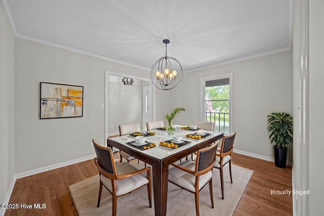 301 Pine Crest Rd, Trent Woods, NC 28562 - dining area with wood finished floors, crown molding, baseboards, and a chandelier