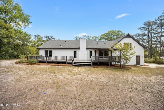 301 Pine Crest Rd, Trent Woods, NC 28562 - back of house featuring a chimney, a wooden deck, and roof with shingles