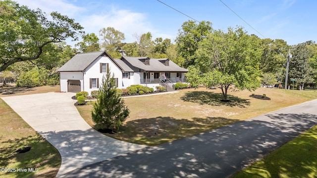 301 Pine Crest Rd, Trent Woods, NC 28562 - view of front of house featuring covered porch, a garage, driveway, and view of scattered trees