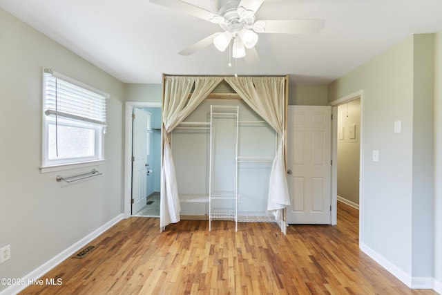 117 Brookfield Dr, Wilmington, NC 28405 - unfurnished bedroom featuring light wood-style flooring, baseboards, and a closet