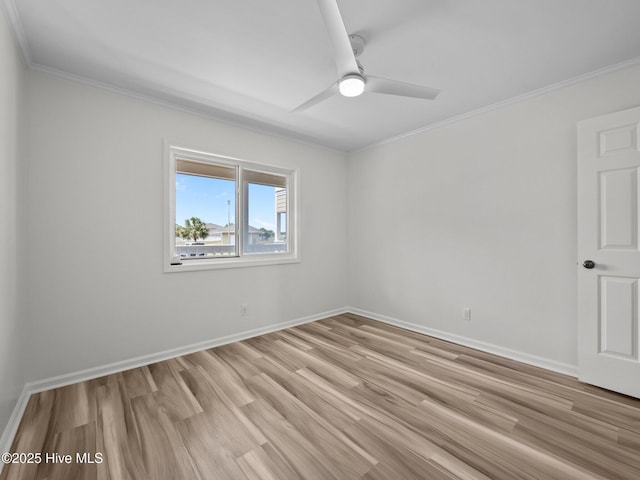 unfurnished room featuring crown molding, light wood finished floors, ceiling fan, and baseboards
