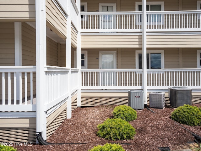 view of home's exterior with central AC unit and covered porch