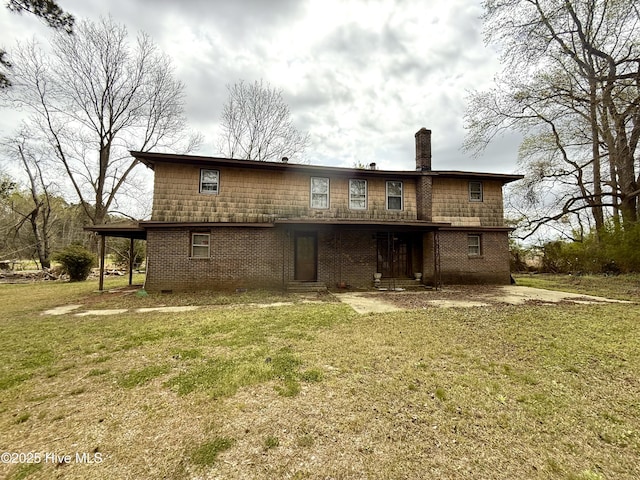 610 S Main St, Roxobel, NC 27872 - back of house with brick siding, a chimney, and a yard