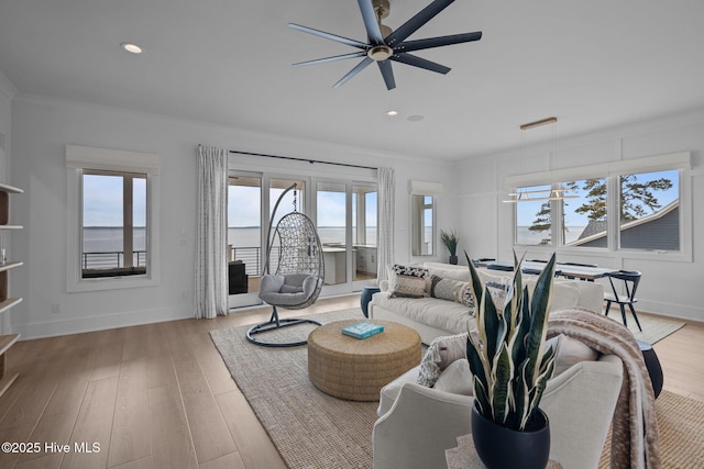 546 S Brightleaf Dr, Minnesott Beach, NC 28510 - living area with recessed lighting, light wood-type flooring, ornamental molding, baseboards, and ceiling fan