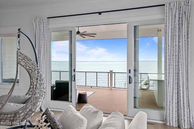 546 S Brightleaf Dr, Minnesott Beach, NC 28510 - living area featuring ornamental molding, a water view, and ceiling fan