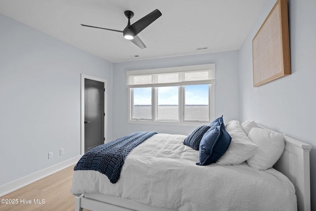 546 S Brightleaf Dr, Minnesott Beach, NC 28510 - bedroom featuring baseboards, ceiling fan, visible vents, and light wood finished floors