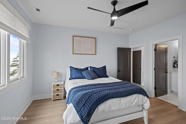546 S Brightleaf Dr, Minnesott Beach, NC 28510 - bedroom featuring a ceiling fan, light wood finished floors, attic access, ensuite bathroom, and baseboards