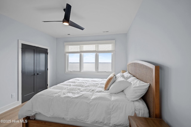546 S Brightleaf Dr, Minnesott Beach, NC 28510 - bedroom featuring light wood finished floors, baseboards, a closet, and a ceiling fan