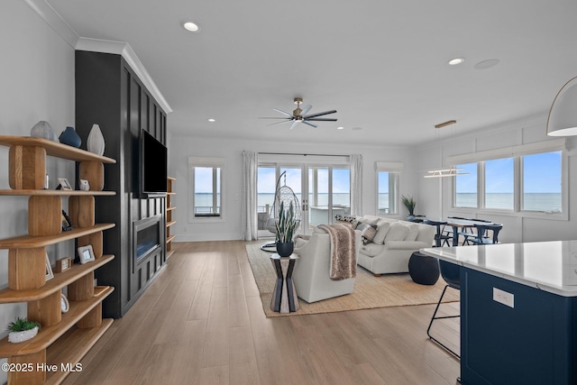 546 S Brightleaf Dr, Minnesott Beach, NC 28510 - living room with recessed lighting, light wood-style flooring, ornamental molding, and a ceiling fan