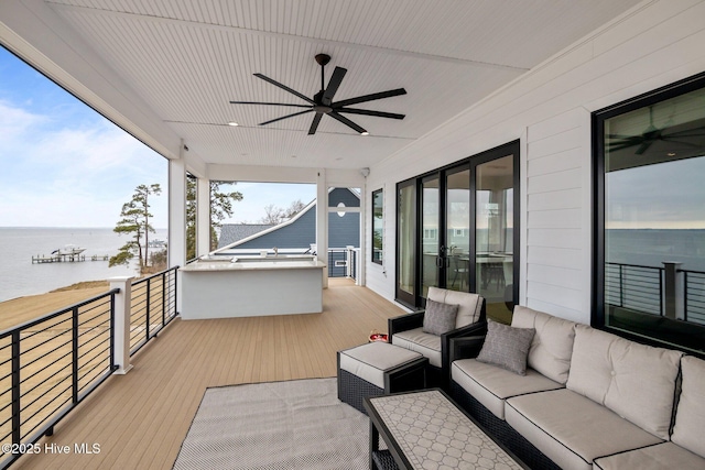 546 S Brightleaf Dr, Minnesott Beach, NC 28510 - wooden deck with outdoor lounge area, a water view, and a ceiling fan