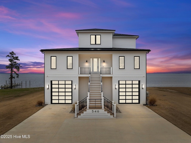 546 S Brightleaf Dr, Minnesott Beach, NC 28510 - view of front of home featuring driveway, a standing seam roof, and metal roof